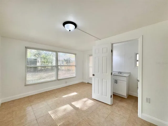 a view of an empty room with a window