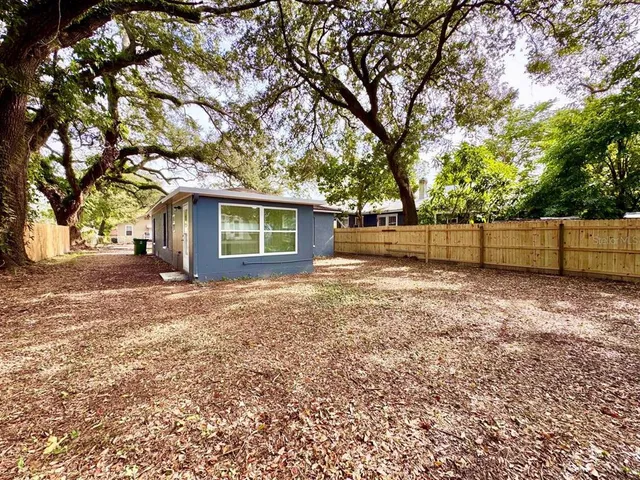 a view of backyard with green space