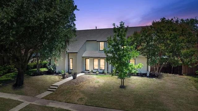 a house with trees in the background