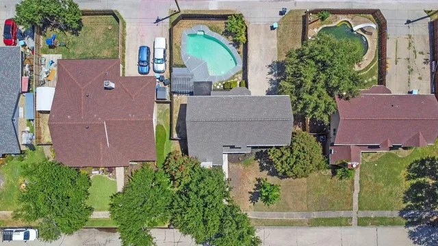 an aerial view of a house with a lake view