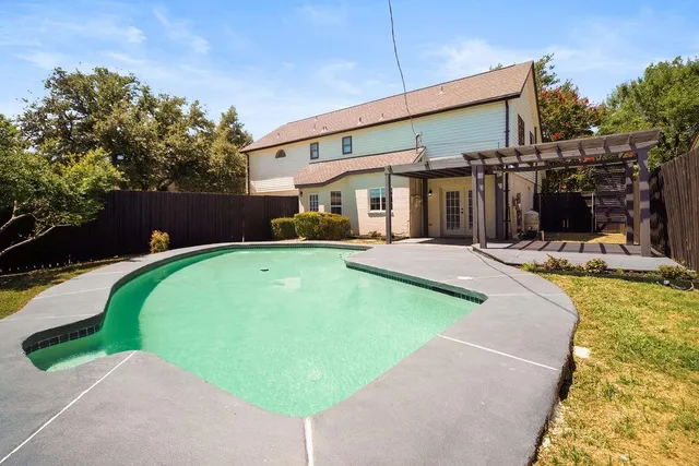 a view of a house with a swimming pool