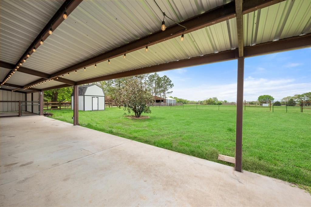 504 Texas Street Tioga, TX 76271 - Photo 13 of 38 a view of a porch with furniture and garden