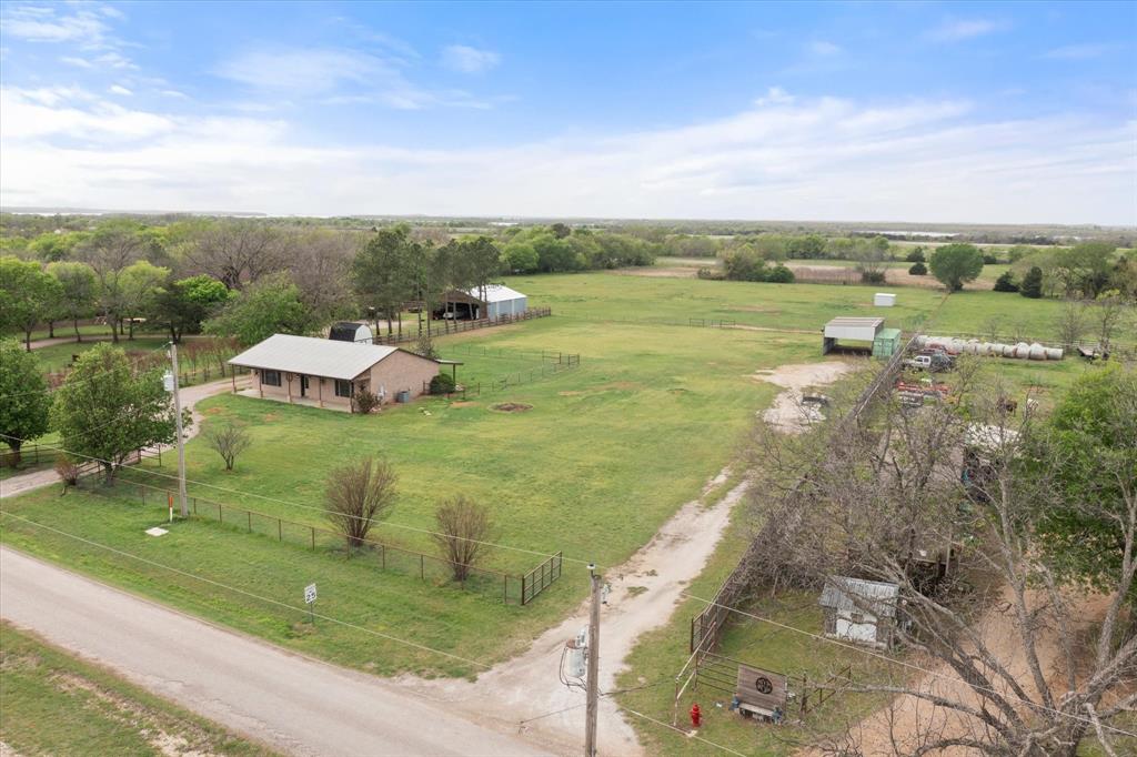 504 Texas Street Tioga, TX 76271 - Photo 3 of 38 a view of a lake with a yard