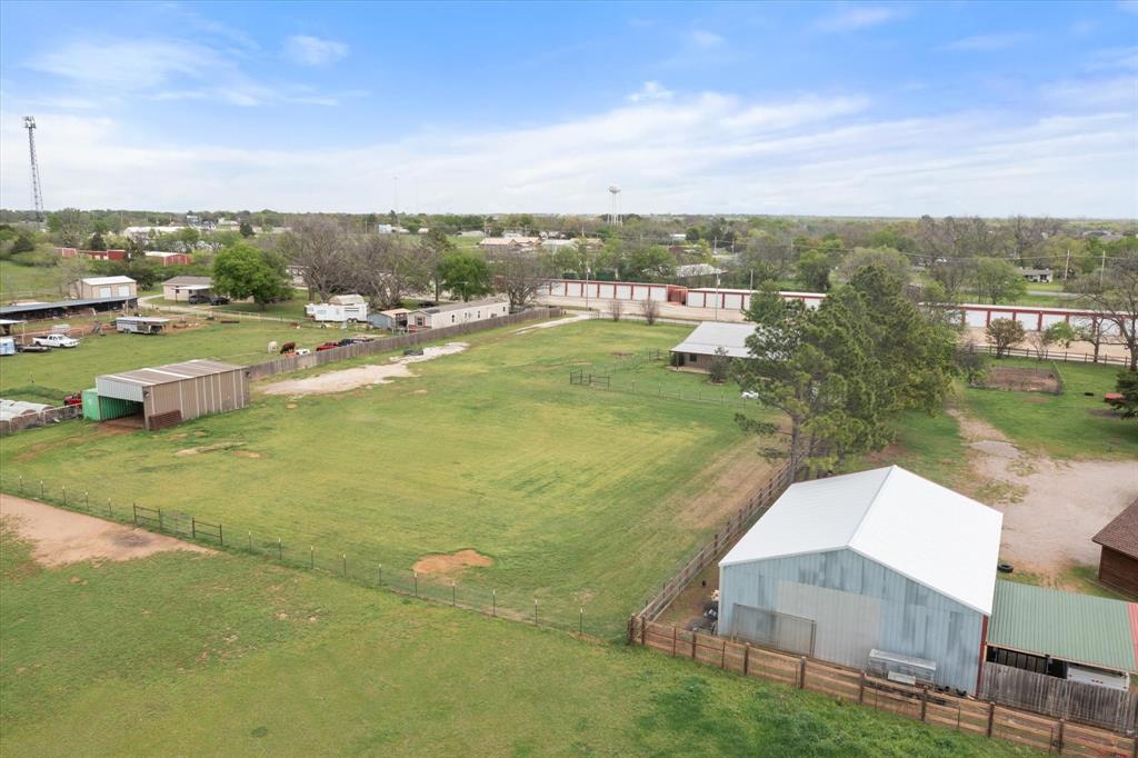 504 Texas Street Tioga, TX 76271 - Photo 5 of 38 a view of a lake with a yard