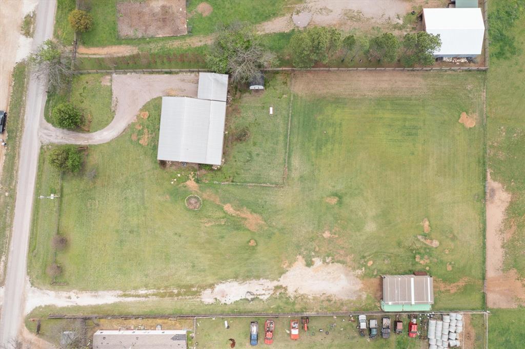 504 Texas Street Tioga, TX 76271 - Photo 7 of 38 an aerial view of residential house with pool and yard