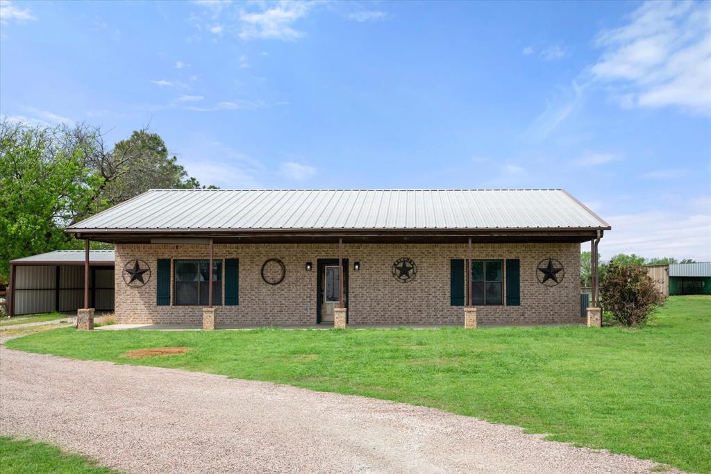504 Texas Street Tioga, TX 76271 - Photo 8 of 38 a front view of house with yard and green space