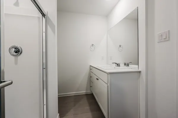 a utility room with cabinets washer and dryer