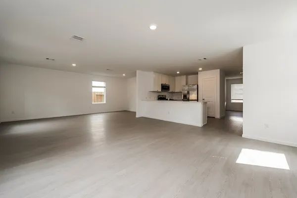 a view of a kitchen with a sink and a stove top oven