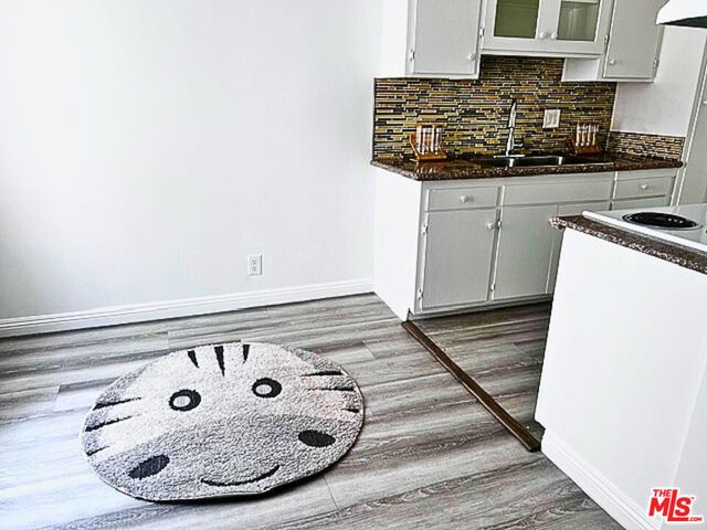 a kitchen with a stove and a cabinets