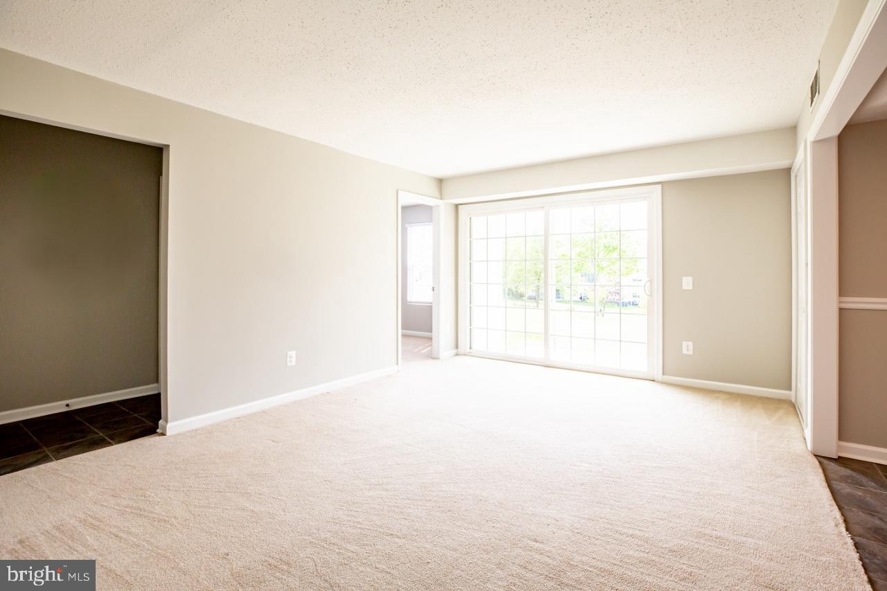 Living room with sliding glass door to patio