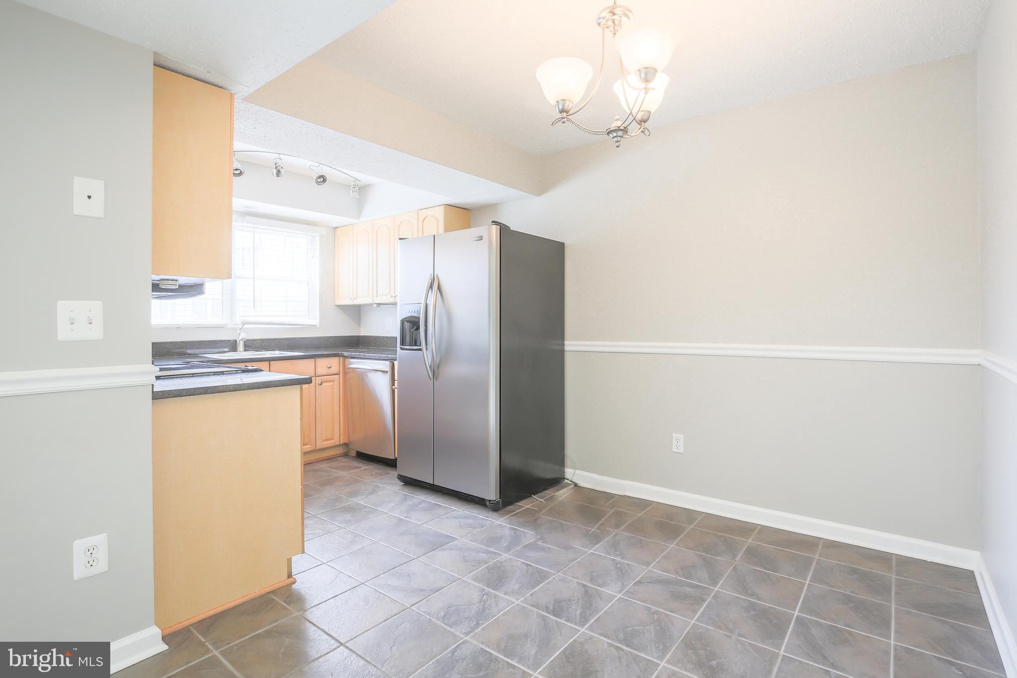 129 Fort Evans Road Southeast, Unit B Leesburg, VA 20175 - Photo 8 of 20 Kitchen with tile floor and table space