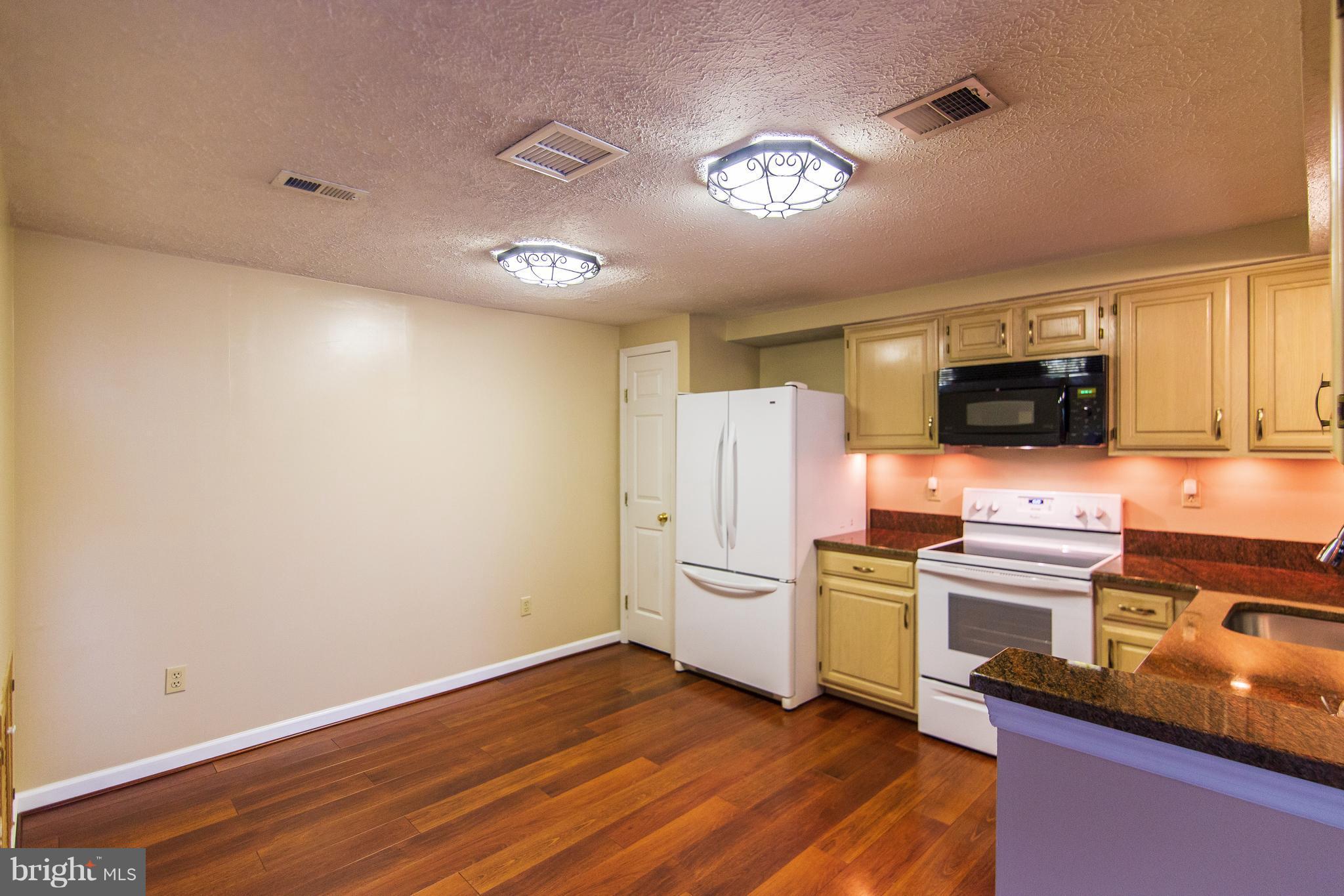 593 Cascade Way Frederick, MD 21703 - Photo 12 of 24 eat-in Kitchen with wood floors and granite