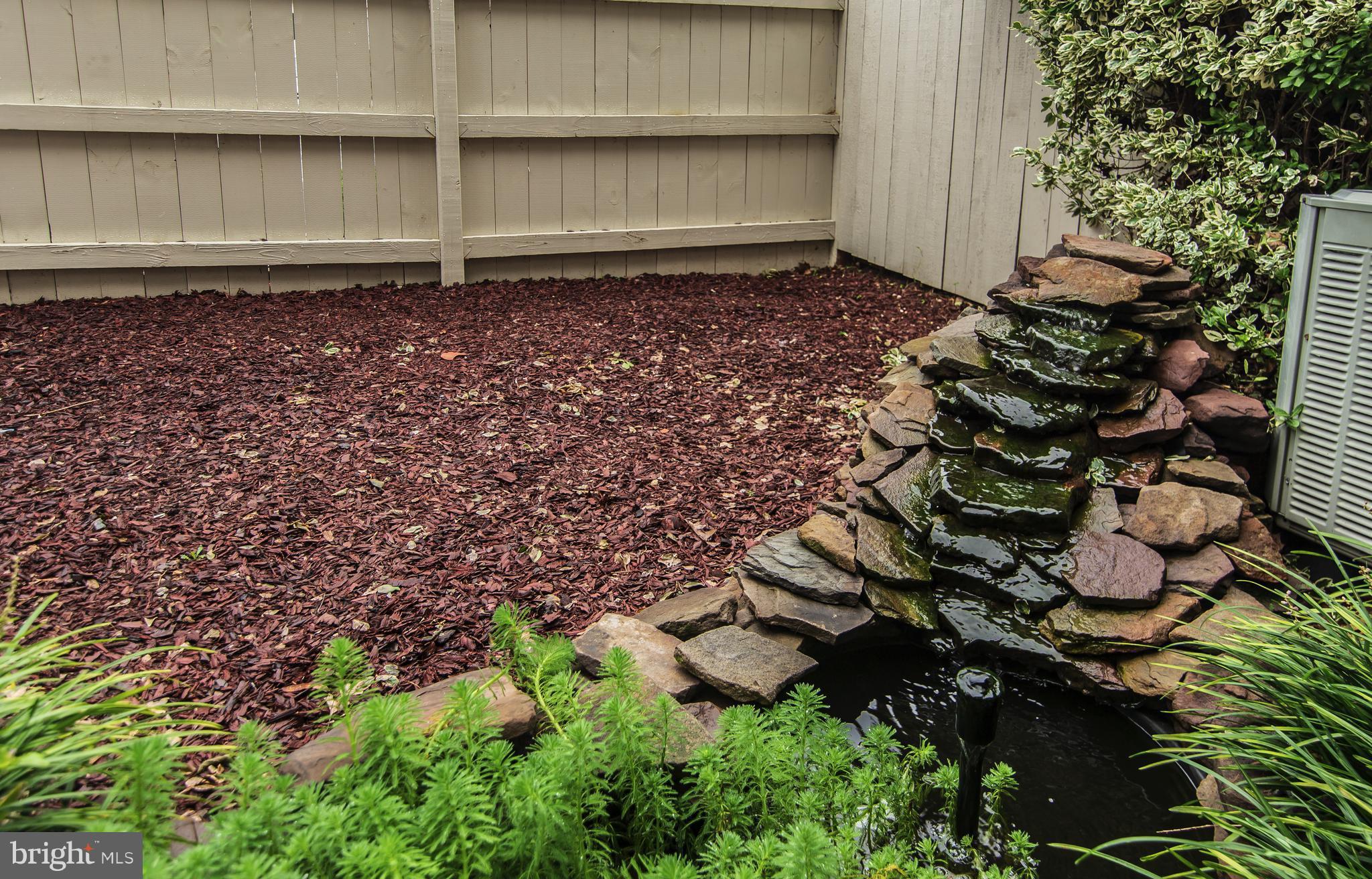 593 Cascade Way Frederick, MD 21703 - Photo 6 of 24 stone pond with fountain