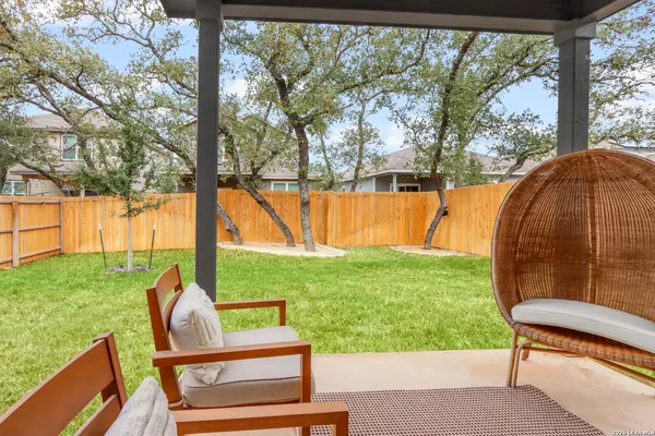 a view of a two chairs in the garden