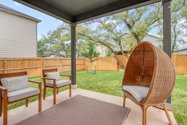 a view of a two chairs in the deck