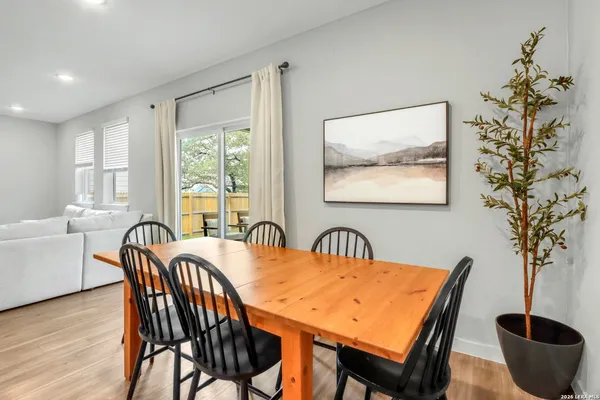 a view of a dining room with furniture window and wooden floor