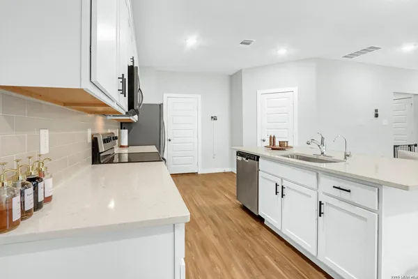 a large kitchen with cabinets