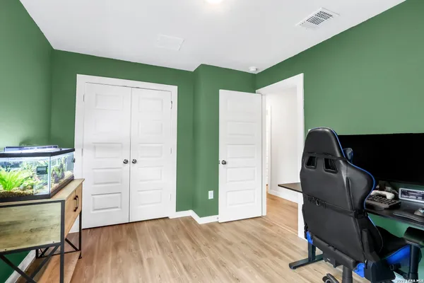 a workspace with furniture and wooden floor