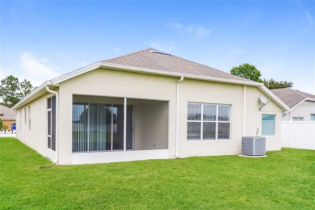 a view of front of house with a yard