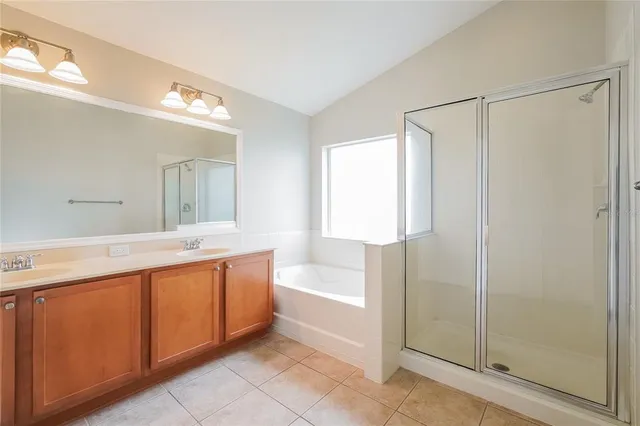 a bathroom with a bathtub and a sink