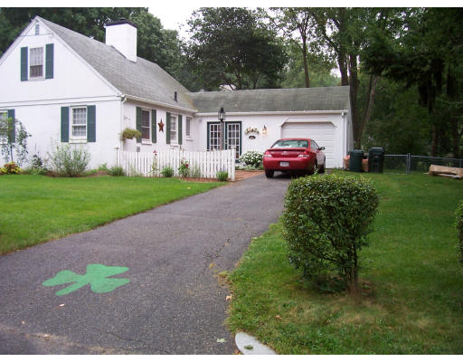 104 West Allen Ridge Road Springfield, MA 01118 - Photo 1 of 4 a front view of a house with a garden and trees