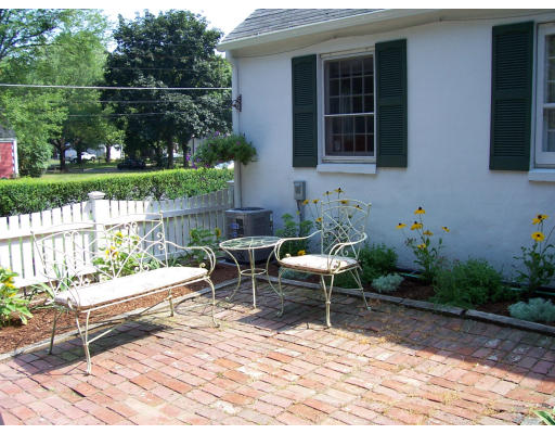 104 West Allen Ridge Road Springfield, MA 01118 - Photo 3 of 4 a backyard of a house with yard table and chairs