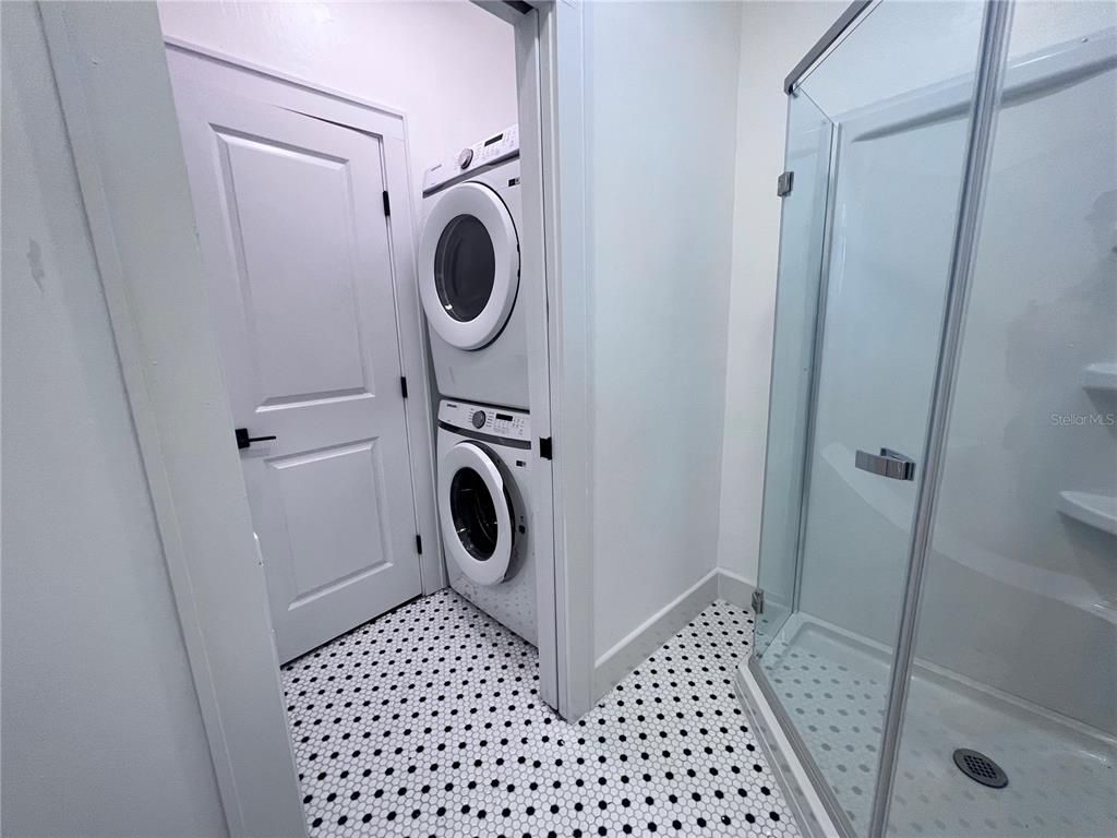 204 Northwest 3 Street Gainesville, FL 32601 - Photo 5 of 5 a bathroom with a sink a washer and dryer
