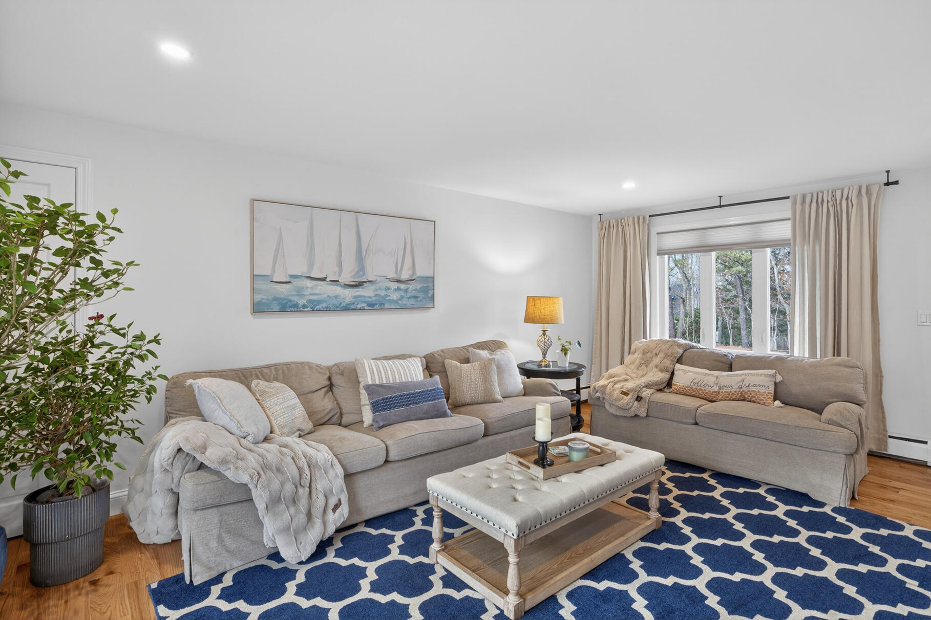 24 Surrey Lane Sandwich, MA 02563 - Photo 15 of 61 a living room with furniture and a large window with garden view
