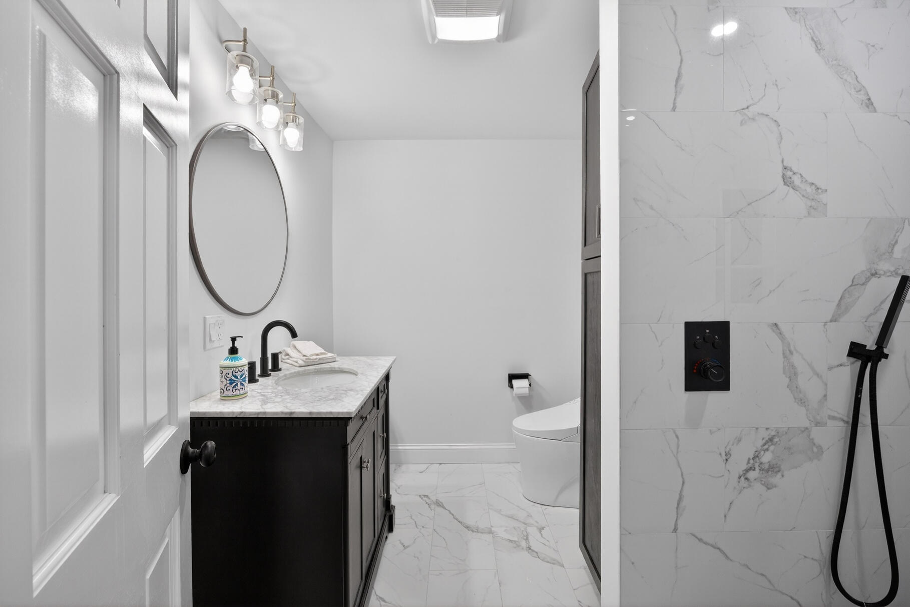 24 Surrey Lane Sandwich, MA 02563 - Photo 29 of 61 a bathroom with a double vanity sink and a mirror