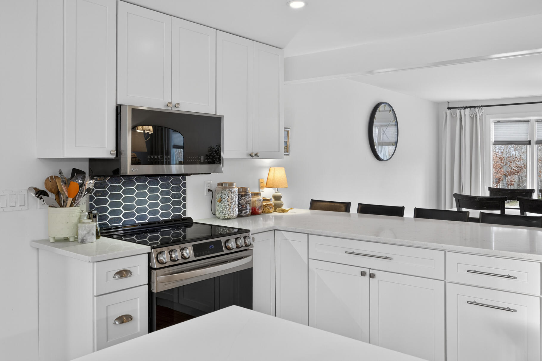 24 Surrey Lane Sandwich, MA 02563 - Photo 3 of 61 a kitchen with white cabinets and appliances