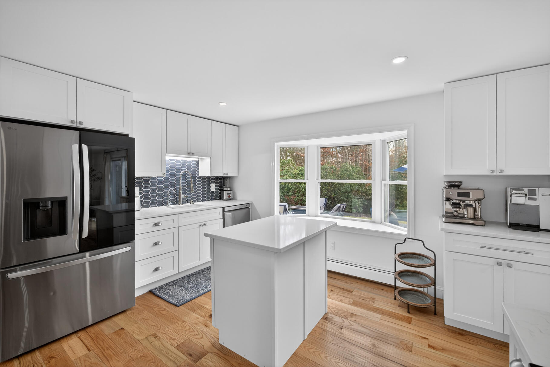 24 Surrey Lane Sandwich, MA 02563 - Photo 4 of 61 a kitchen with granite countertop a sink appliances cabinets and counter space