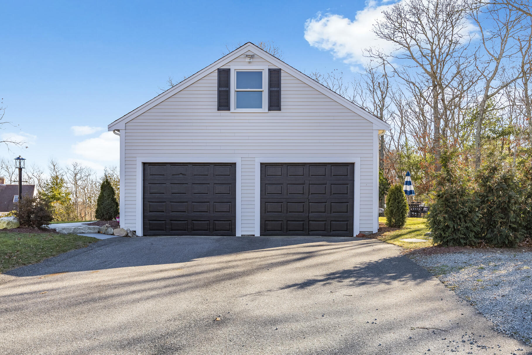 24 Surrey Lane Sandwich, MA 02563 - Photo 57 of 61 a view of a house with a yard and garage