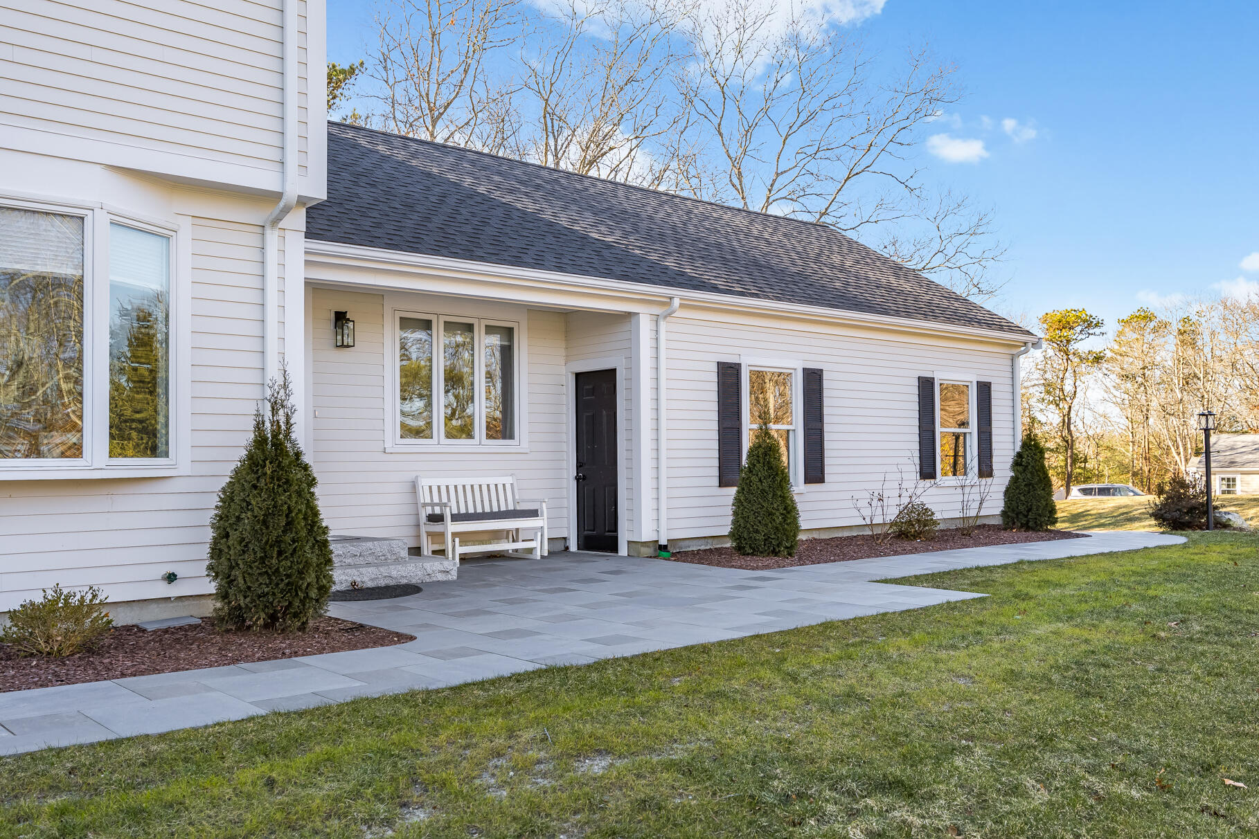 24 Surrey Lane Sandwich, MA 02563 - Photo 60 of 61 a view of a house with backyard and porch