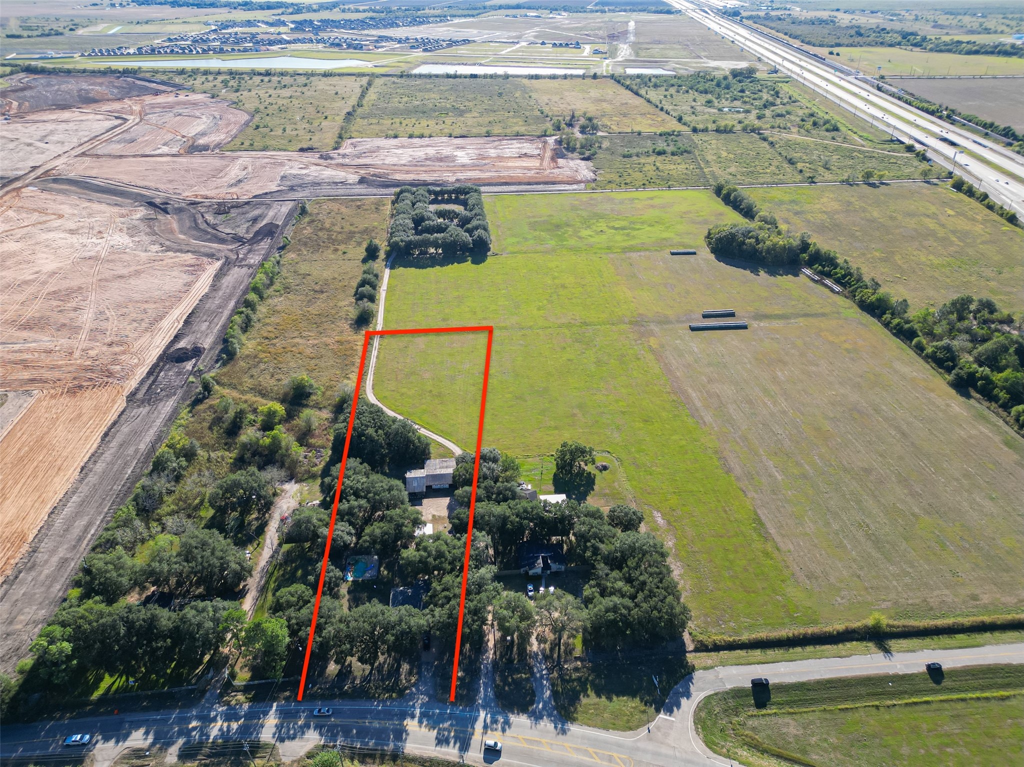 402 FM 360 Road Beasley, TX 77417 - Photo 1 of 12 a view of a swimming pool with a yard and seating area