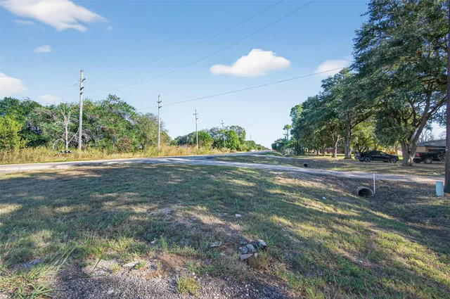 a view of outdoor space with green field and trees