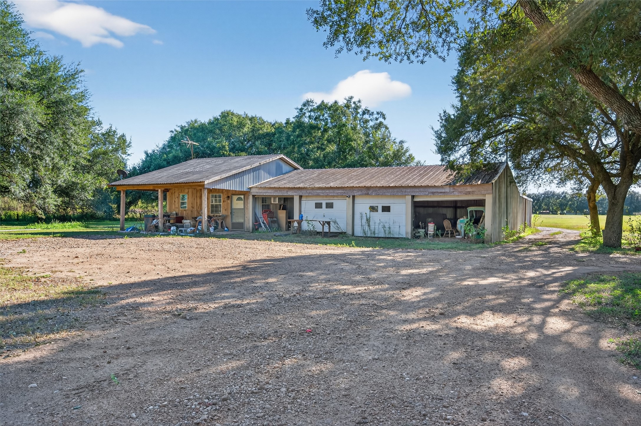 402 FM 360 Road Beasley, TX 77417 - Photo 8 of 12 a front view of a house with a garden