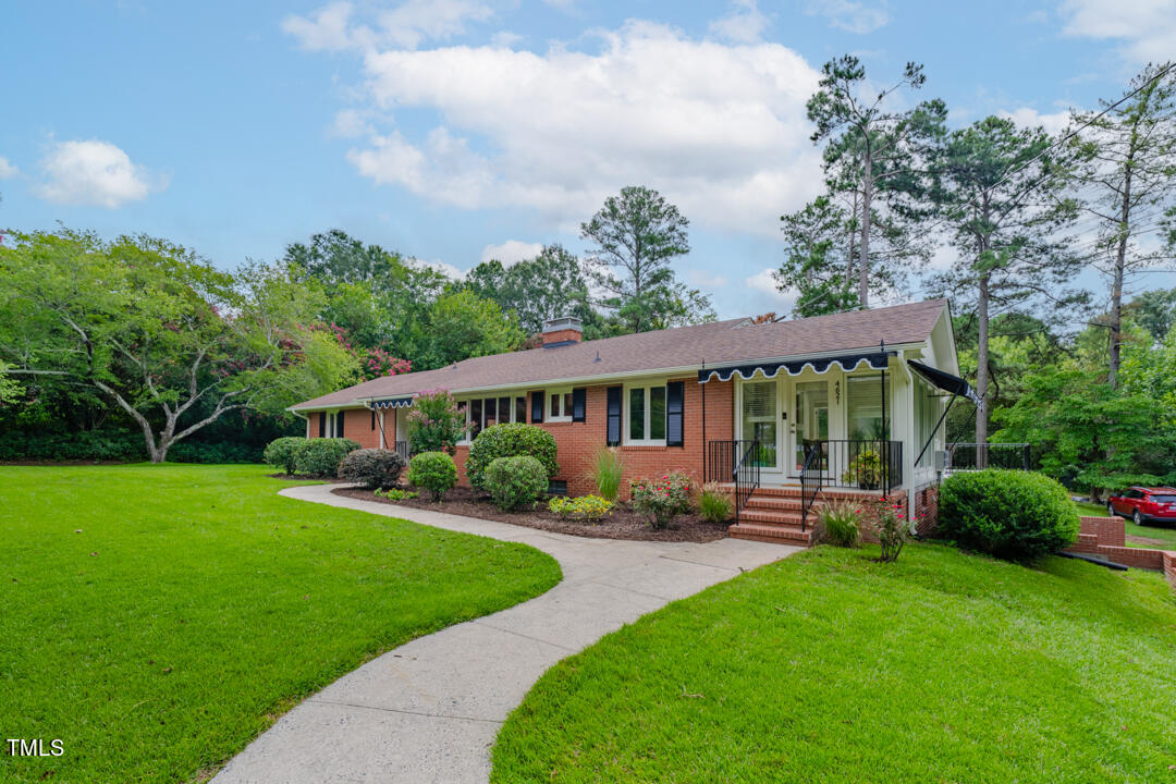 4621 Erwin Road Durham, NC 27705 - Photo 1 of 40 a view of a house with a backyard and patio