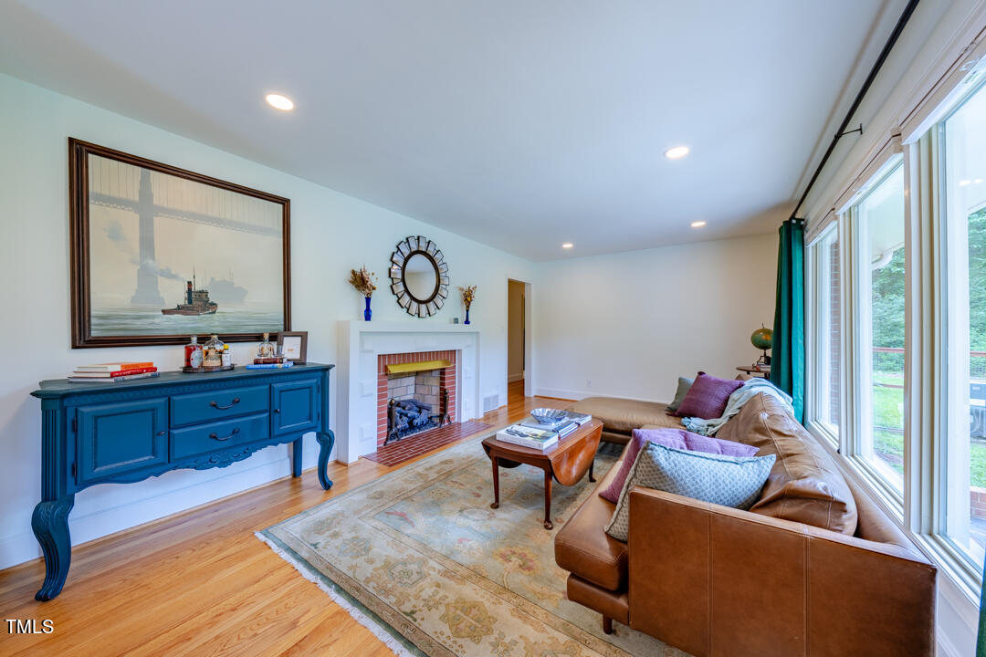 4621 Erwin Road Durham, NC 27705 - Photo 11 of 40 a living room with furniture and a fireplace