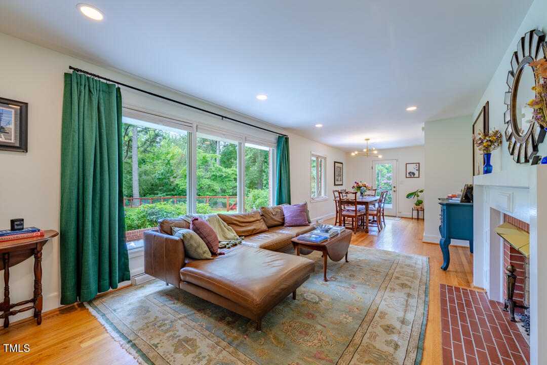4621 Erwin Road Durham, NC 27705 - Photo 12 of 40 a living room with furniture and a large window