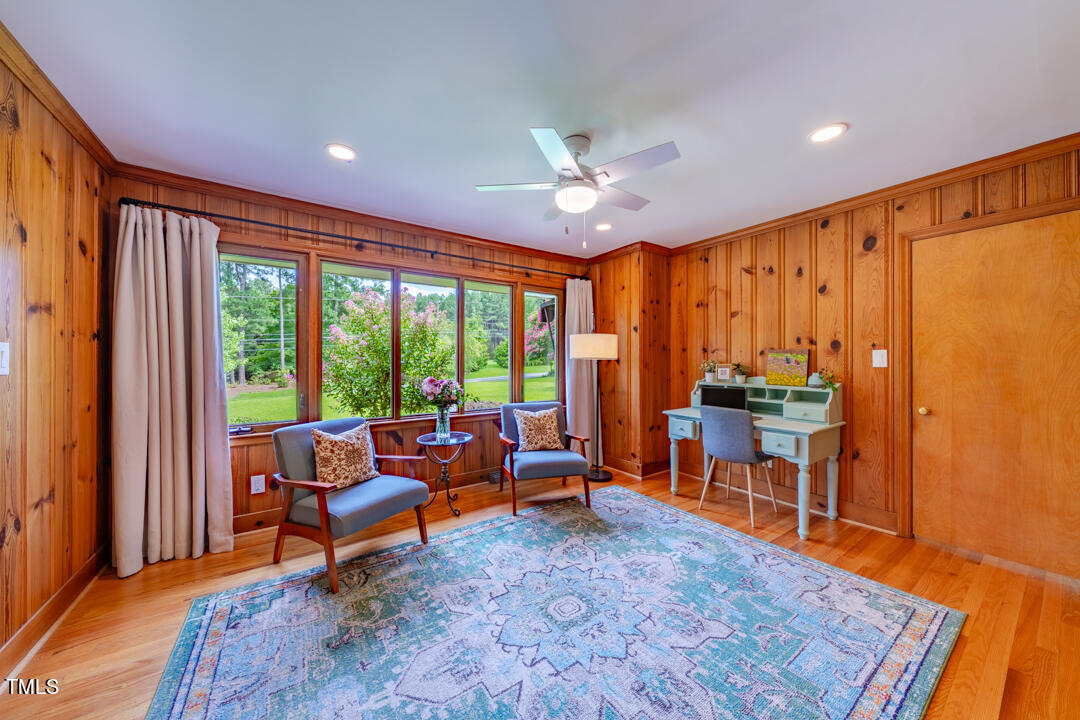 4621 Erwin Road Durham, NC 27705 - Photo 15 of 40 a living room with furniture a table and chairs