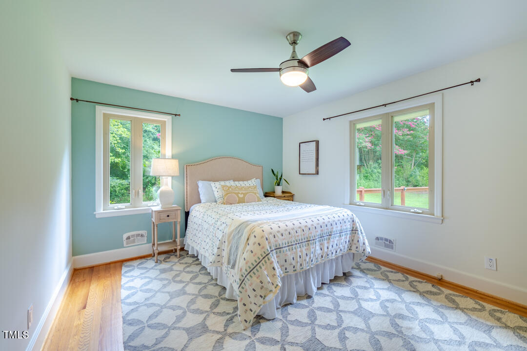 4621 Erwin Road Durham, NC 27705 - Photo 16 of 40 a bedroom with a bed and a window