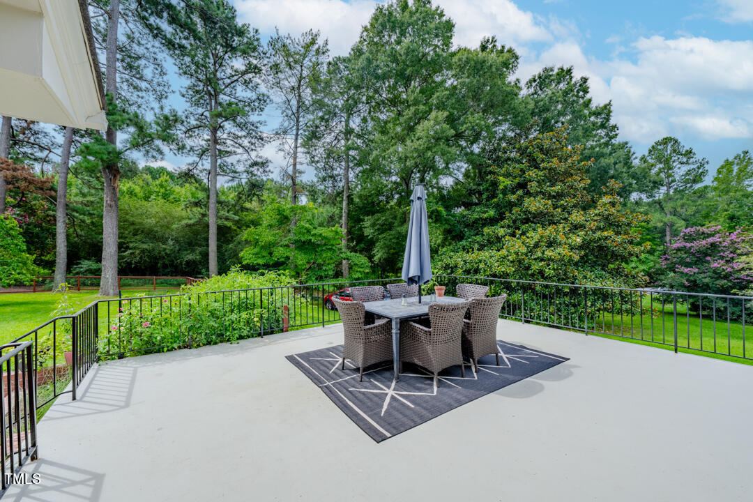 4621 Erwin Road Durham, NC 27705 - Photo 22 of 40 a view of a table and chairs in the garden