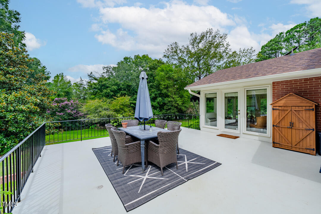 4621 Erwin Road Durham, NC 27705 - Photo 23 of 40 a view of a backyard with sitting area and garden