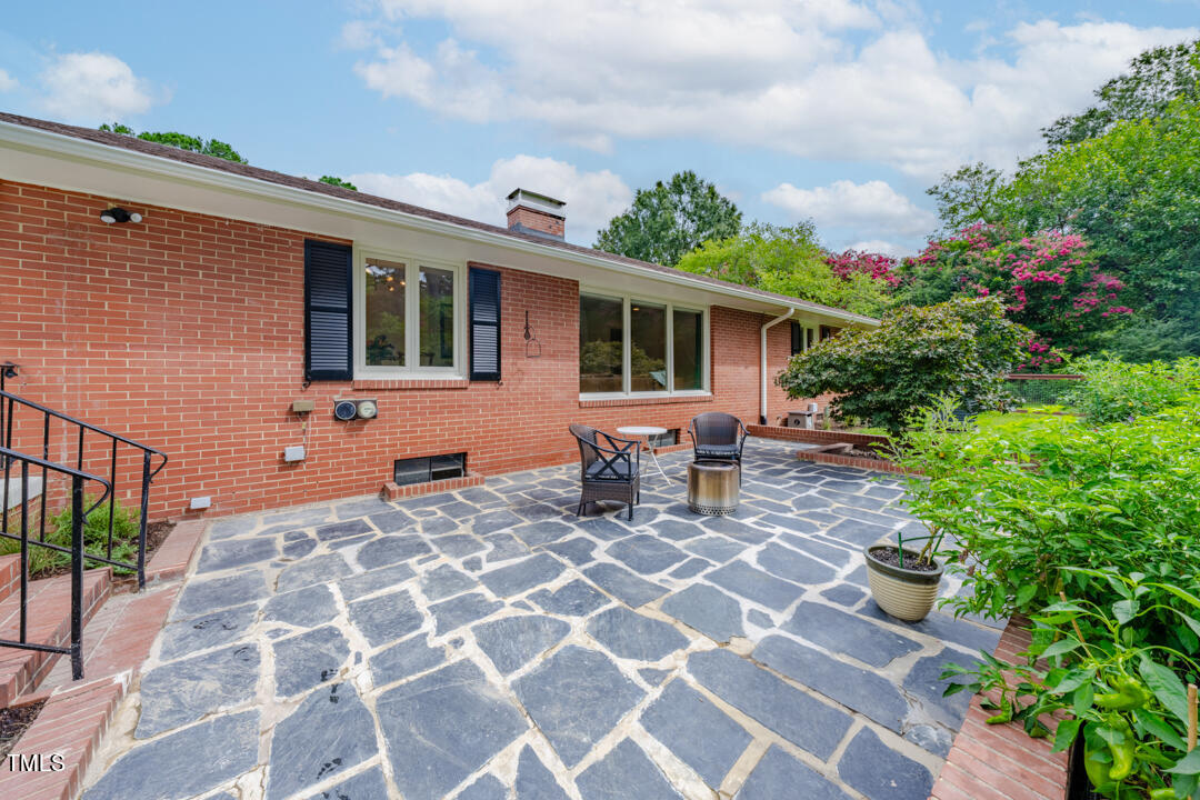 4621 Erwin Road Durham, NC 27705 - Photo 24 of 40 a backyard of a house with table and chairs