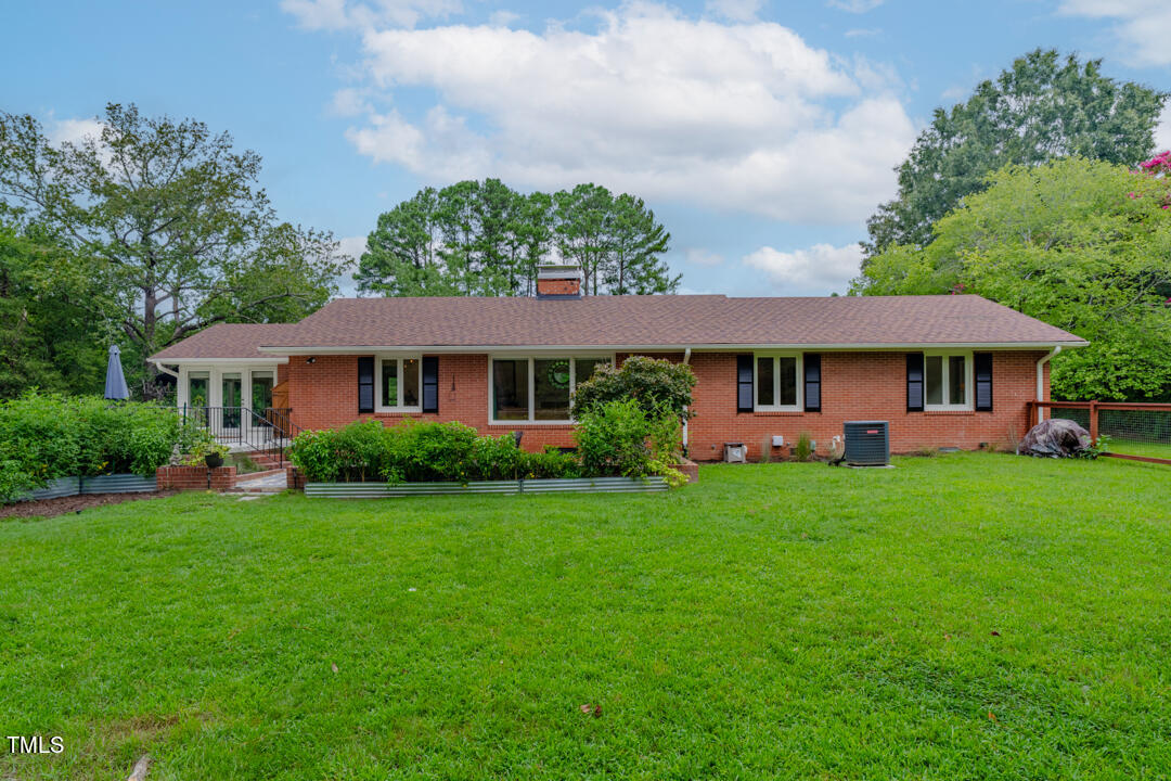 4621 Erwin Road Durham, NC 27705 - Photo 27 of 40 a front view of a house with a yard