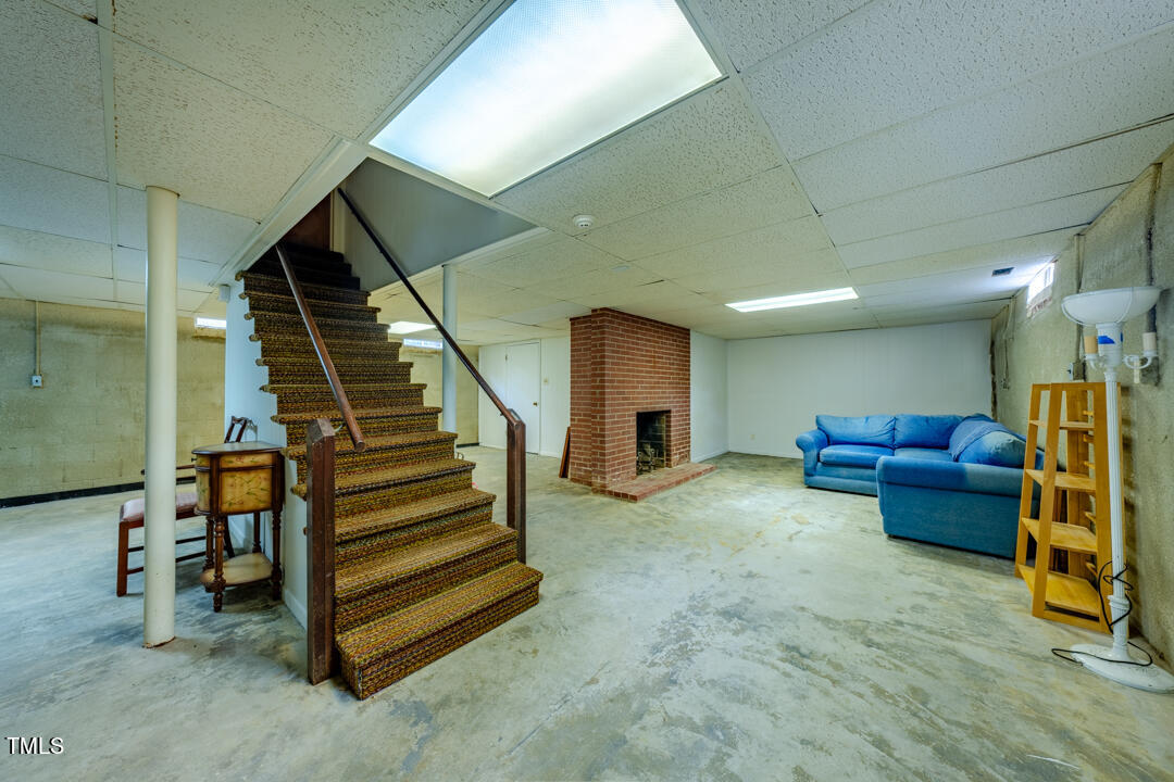 4621 Erwin Road Durham, NC 27705 - Photo 28 of 40 a living room with furniture and a stairs