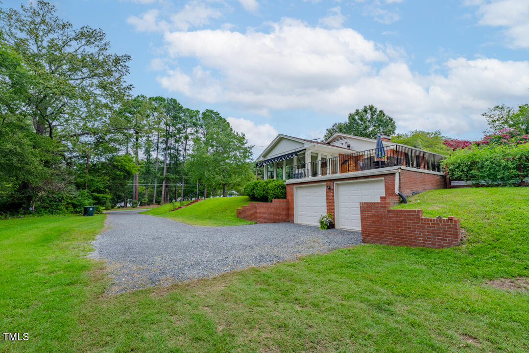 4621 Erwin Road Durham, NC 27705 - Photo 32 of 40 a house with green field in front of it