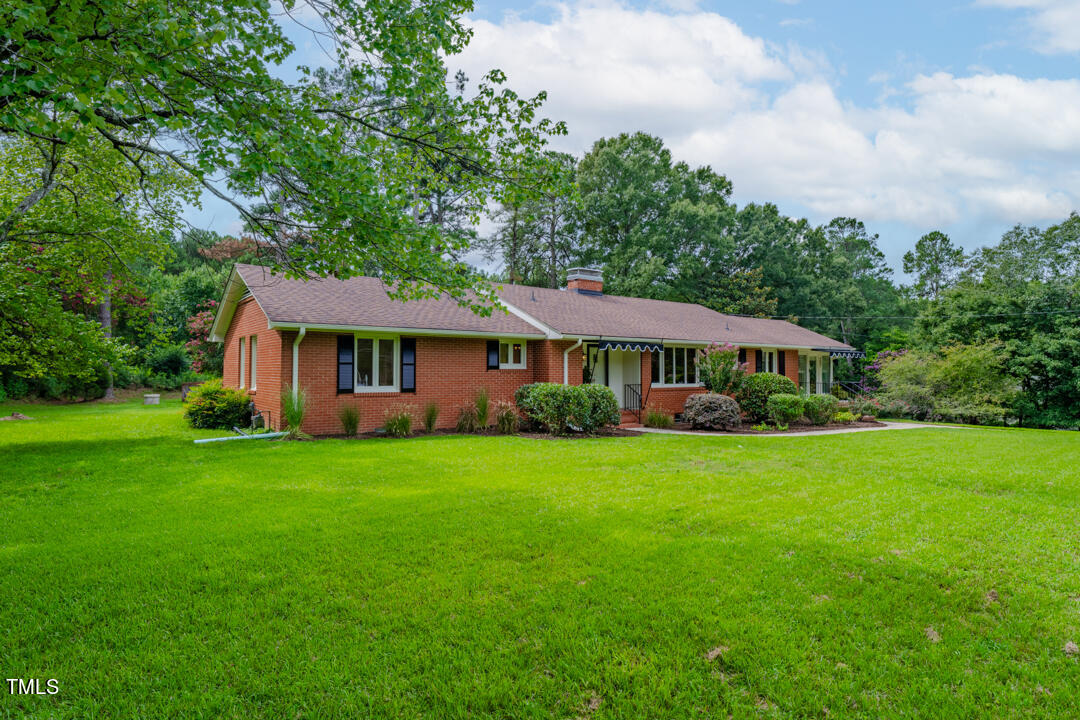 4621 Erwin Road Durham, NC 27705 - Photo 33 of 40 a front of a house with a garden