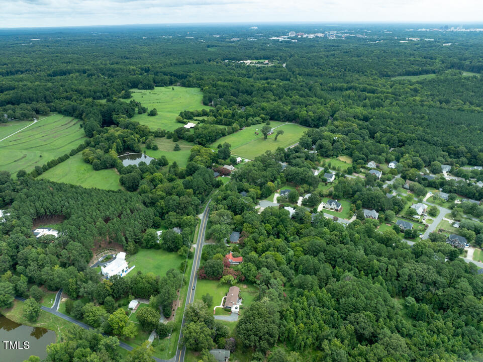 4621 Erwin Road Durham, NC 27705 - Photo 36 of 40 a view of a green field with lots of bushes