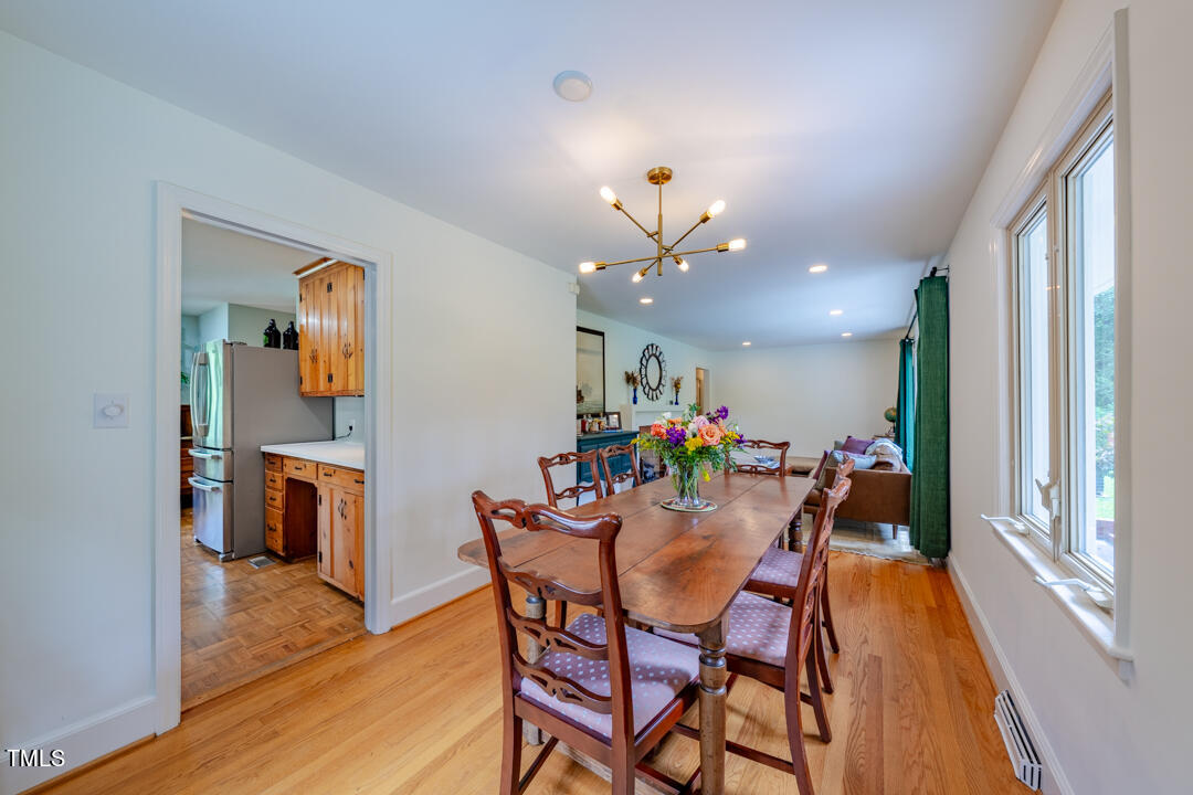 4621 Erwin Road Durham, NC 27705 - Photo 10 of 40 a view of a dining room with furniture and wooden floor